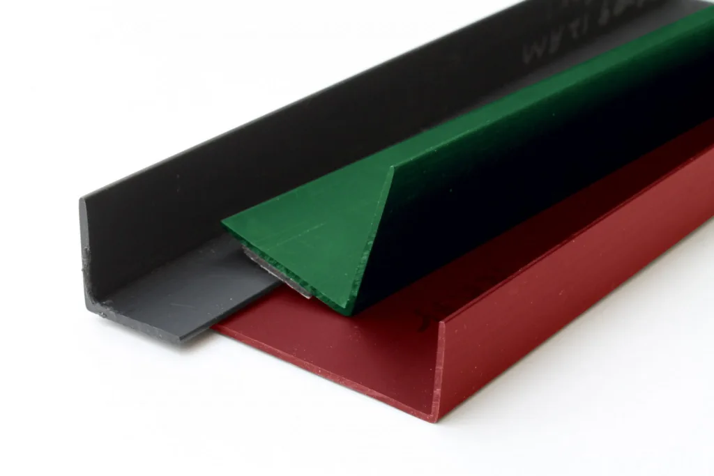 Retail display plastic extrusion profiles including plastic channel and trim components used in store fixtures manufactured in the USA