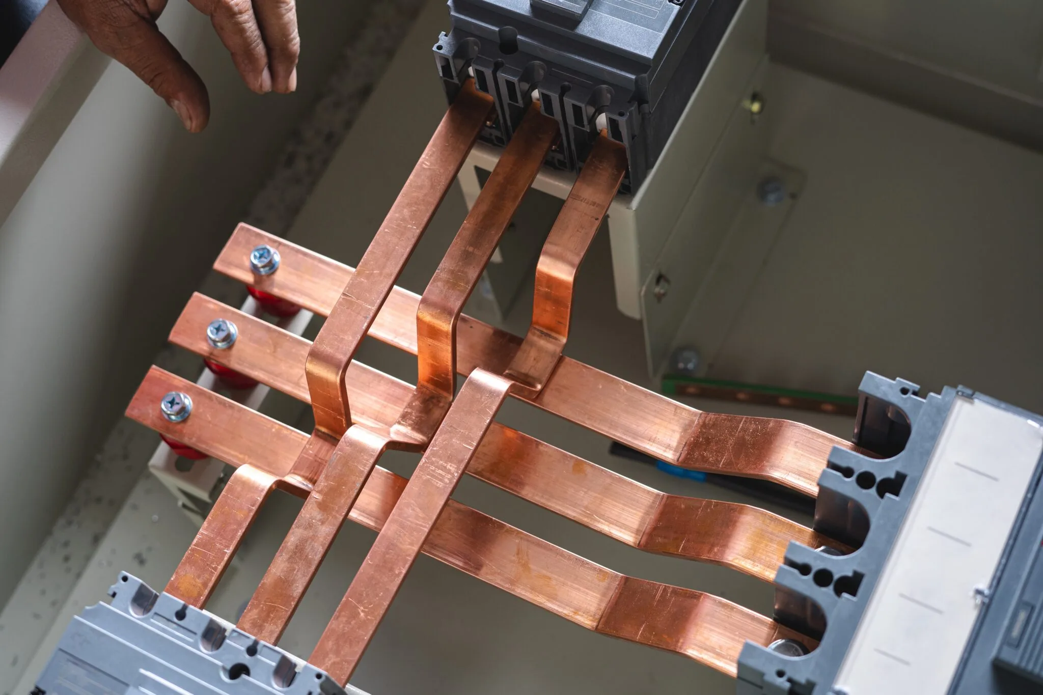 Plastic extrusion profiles designed for insulating and protecting busbars in electrical applications.